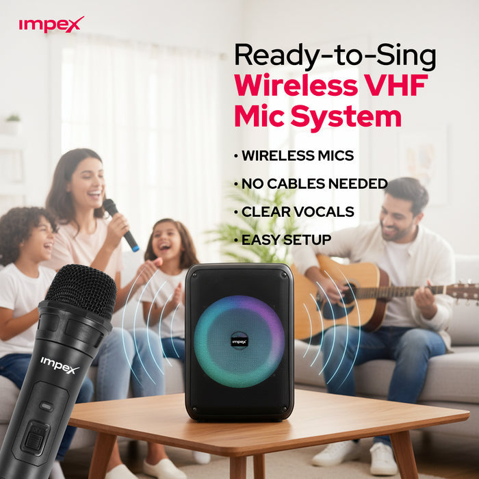 Impex Ready-to-Sing Wireless VHF Mic System featuring a black portable speaker with a colorful circular LED ring on a wooden table, with a close-up of a black Impex microphone in the foreground. In the background, a family is happily singing and playing guitar in a bright living room.